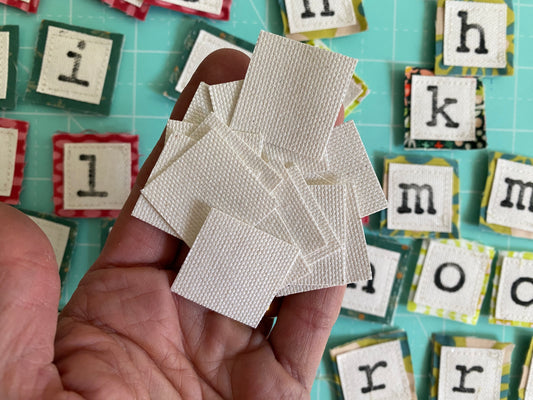 75 White canvas squares -1” x 1”