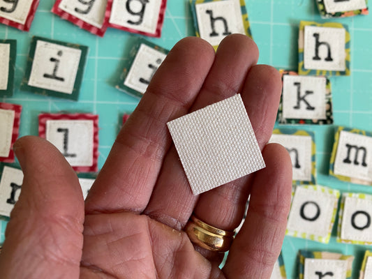 75 White canvas squares -1” x 1”