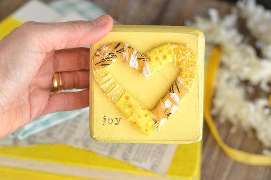 Yellow Wood Sign with Wrapped Heart - Joy