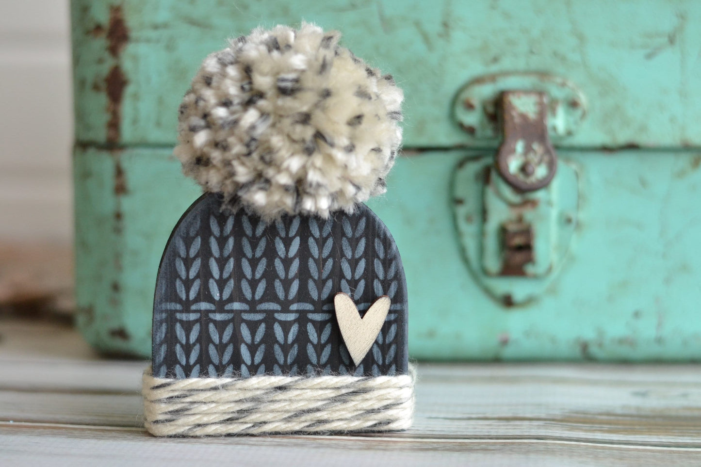 Black winter hat with pom.