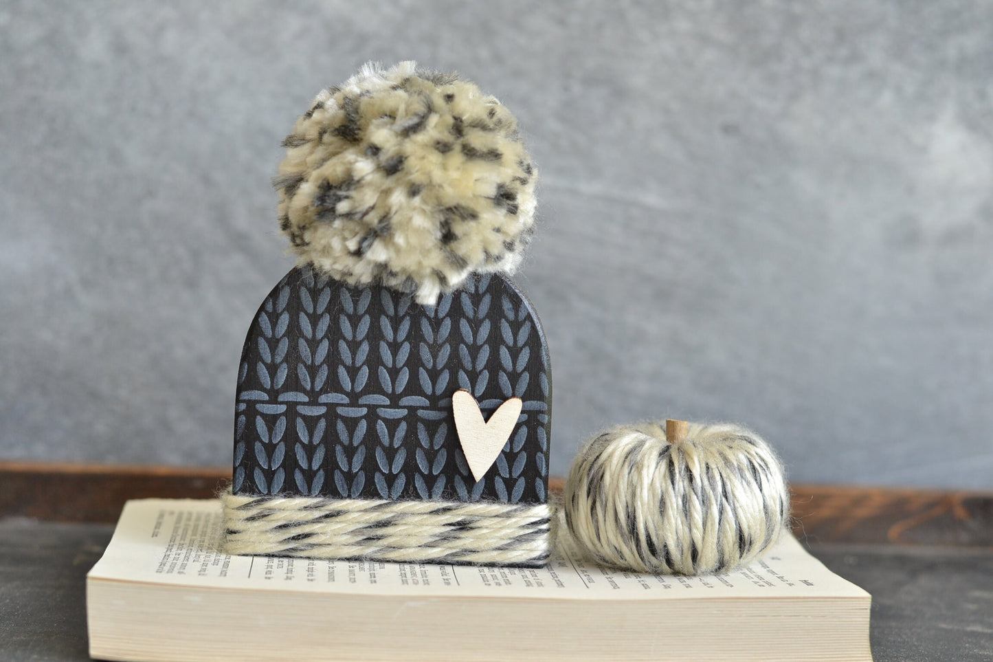 Black winter hat with pom.